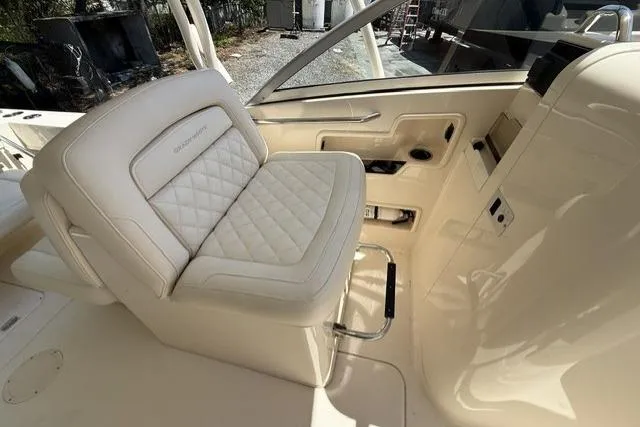 Slide: The Image of 2017 Grady-White Freedom 235 boat interior with luxurious seating and modern design. - 10