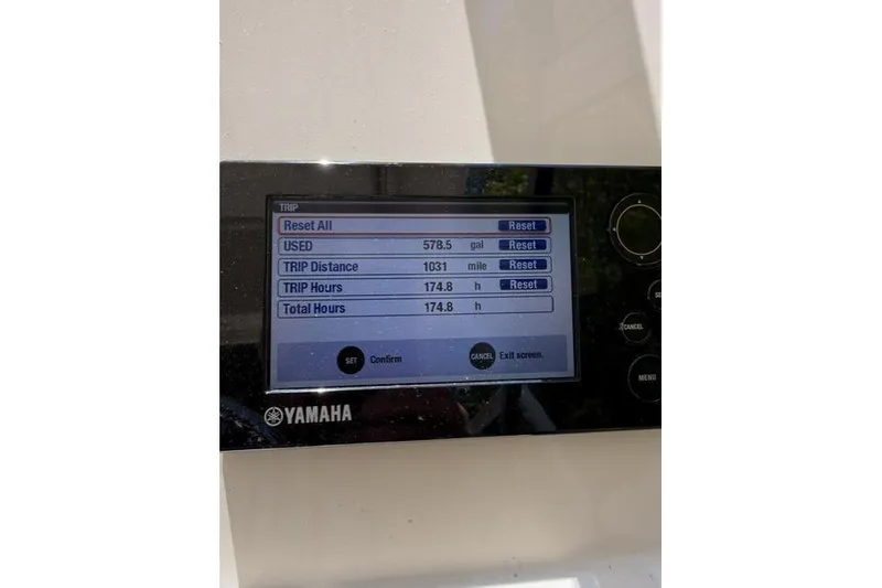 Slide: The Image of Yamaha display showing trip data: 578.5 gallons used, 1031 miles, 174.8 hours. Grady-White Freedom 235. - 11