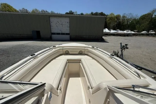 Slide: The Image of 2017 Grady-White Freedom 235 boat bow view in storage yard. - 19