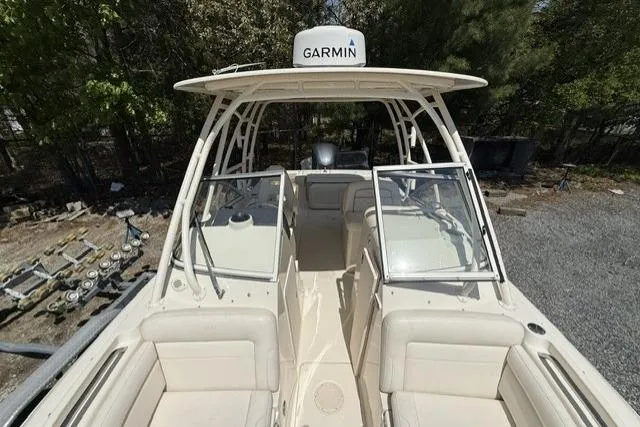 Slide: The Image of 2017 Grady-White Freedom 235 boat with Garmin radar, featuring spacious seating and dual consoles. - 20