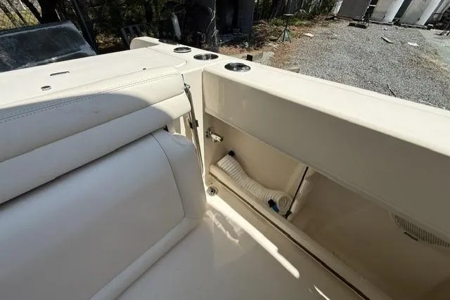 Slide: The Image of 2017 Grady-White Freedom 235 boat interior with seating and storage compartment. - 24