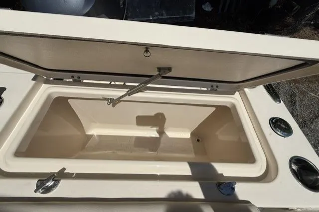 Slide: The Image of Open storage compartment on a 2017 Grady-White Freedom 235 boat. - 26
