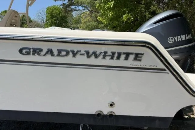 Slide: The Image of 2017 Grady-White Freedom 235 boat with Yamaha engine, side view. - 6