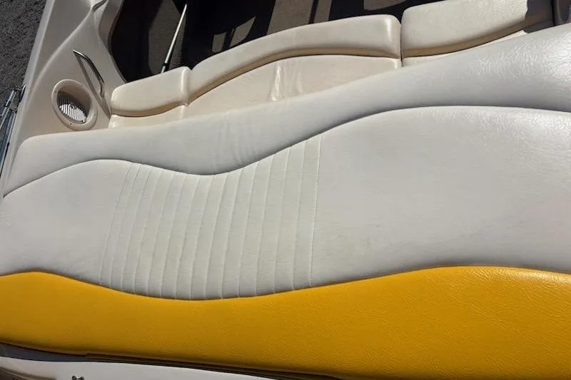 Slide: The Image of 2008 Tahoe Q6 Sport boat interior with white and yellow cushioned seating. - 7