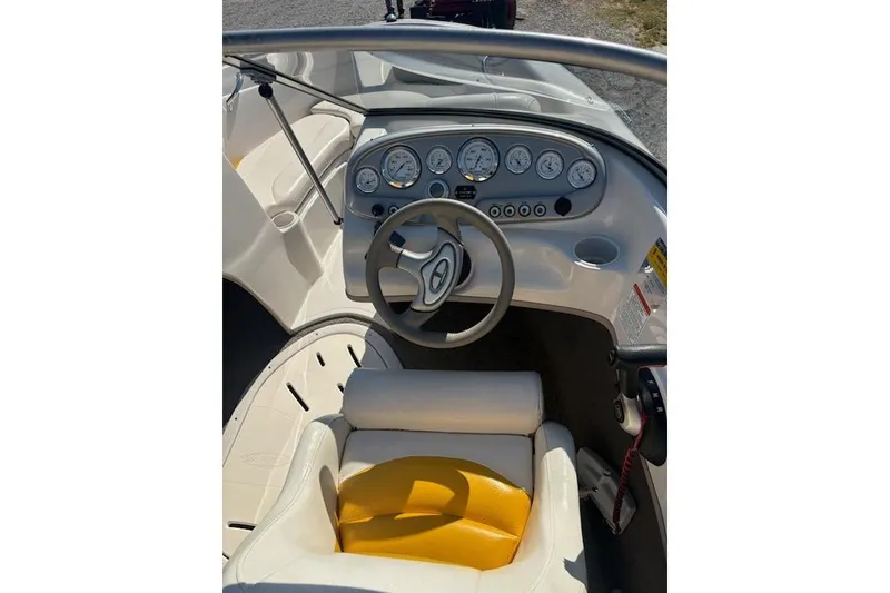 Slide: The Image of 2008 Tahoe Q6 Sport boat dashboard with steering wheel and instrument panel. - 8