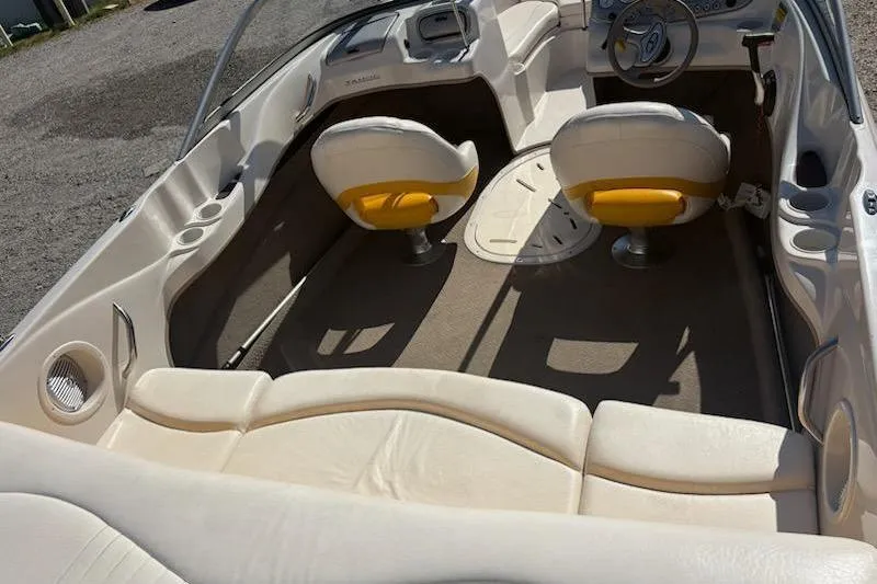 Slide: The Image of 2008 Tahoe Q6 Sport boat interior with beige seating and steering wheel. - 9