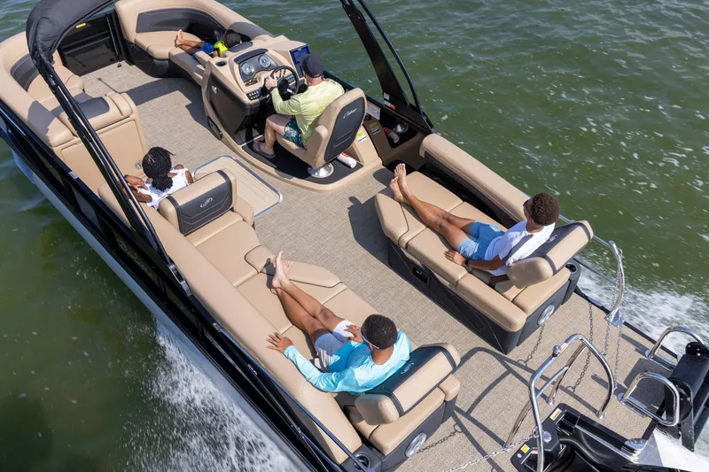 Slide: The Image of 2026 Barletta Cabrio 24 M pontoon boat on the water. - 2