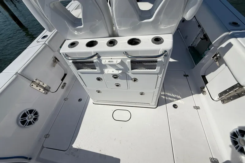Slide: The Image of 2024 Sportsman Open 262 Center Console boat interior with storage and seating. - 16
