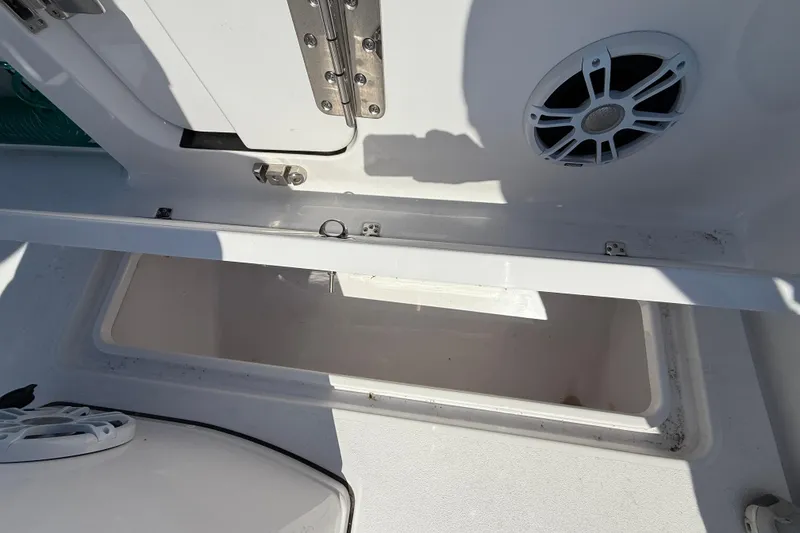 Slide: The Image of 2024 Sportsman Open 262 Center Console storage compartment with speaker detail. - 17