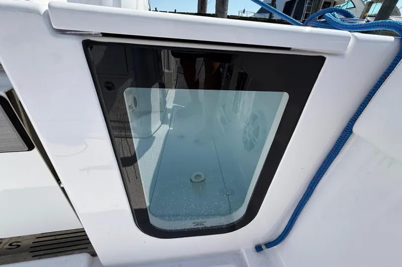Slide: The Image of 2024 Sportsman Open 262 Center Console boat with a glass panel detail. - 20