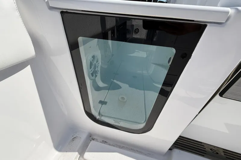 Slide: The Image of 2024 Sportsman Open 262 Center Console boat interior detail with glass panel. - 21