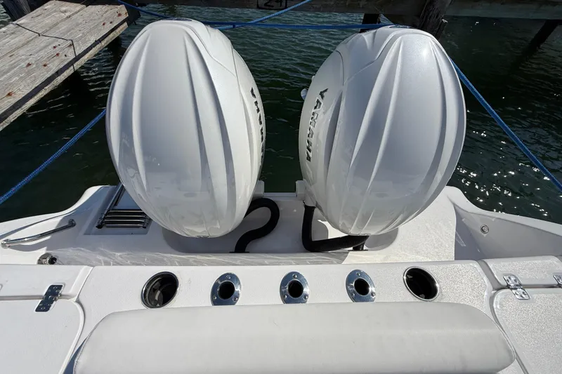 Slide: The Image of 2024 Sportsman Open 262 Center Console with dual Yamaha outboard engines. - 23