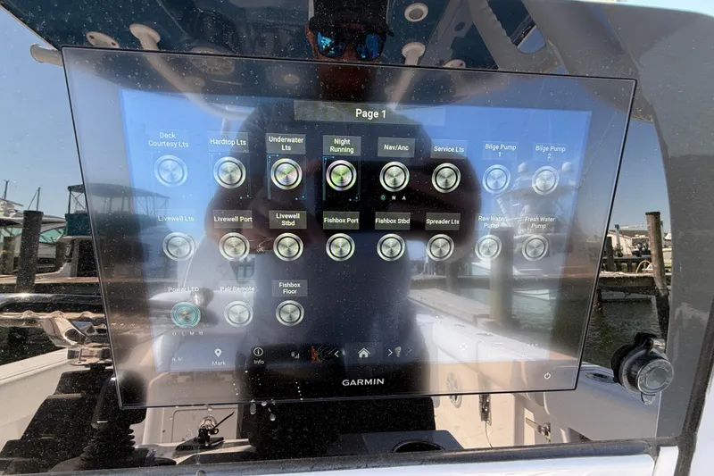 Slide: The Image of 2024 Sportsman Open 262 Center Console touchscreen control panel with various boat functions. - 35