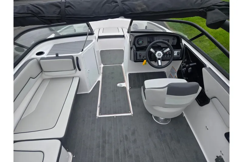 Slide: The Image of 2025 Yamaha Boats AR190 interior with sleek seating and modern dashboard design. - 10