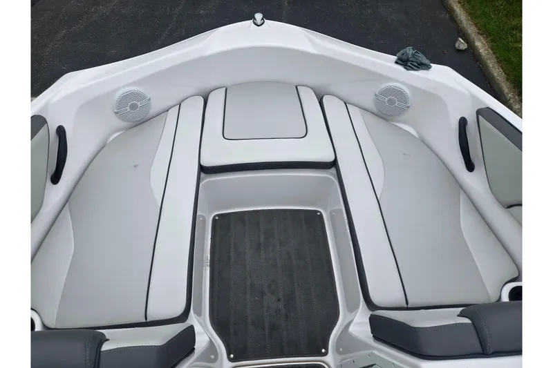 Slide: The Image of 2025 Yamaha Boats AR190 interior with sleek seating and integrated speakers. - 17