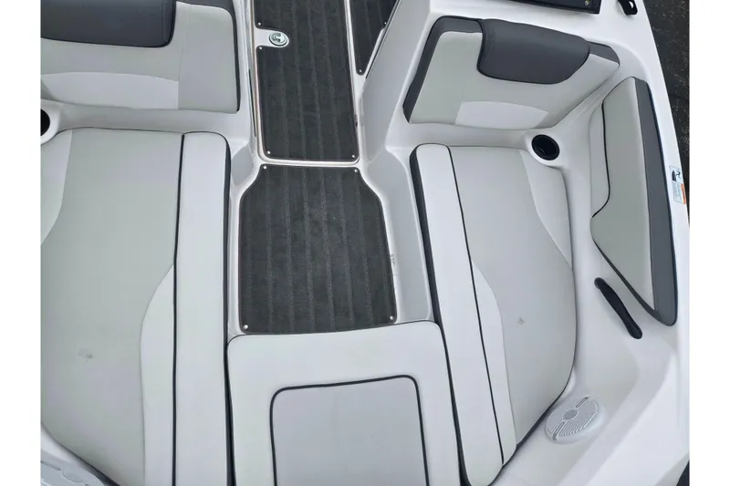 Slide: The Image of 2025 Yamaha Boats AR190 interior seating with gray and white upholstery. - 18