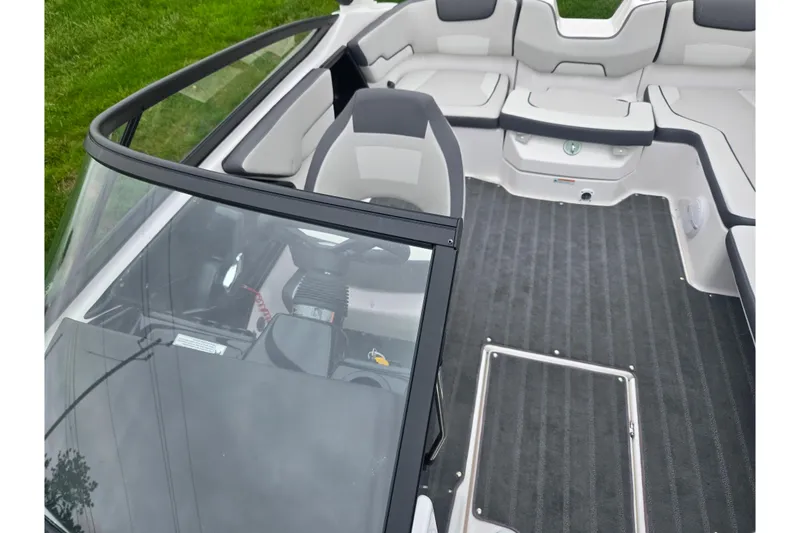 Slide: The Image of 2025 Yamaha Boats AR190 interior with sleek seating and modern dashboard design. - 20