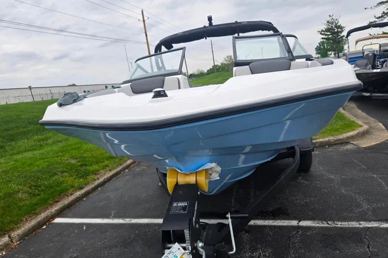 Slide: The Image of 2025 Yamaha Boats AR190 on trailer, parked outdoors, showcasing sleek design and modern features. - 6