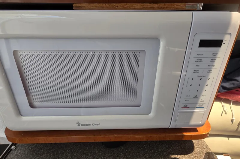 Slide: The Image of Magic Chef microwave oven on a Doral 250se boat, 2001 model. - 12
