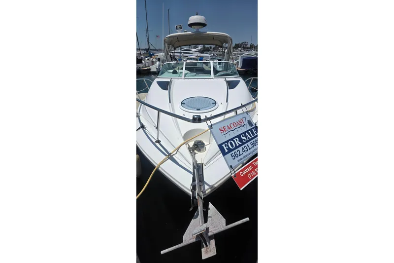 Slide: The Image of 2001 Doral 250se boat for sale at marina, featuring sleek design and spacious deck. - 2