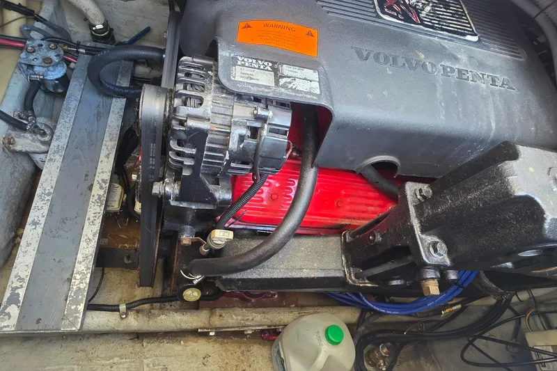 Slide: The Image of Volvo Penta engine in a 2001 Doral 250se boat, showcasing mechanical components. - 30