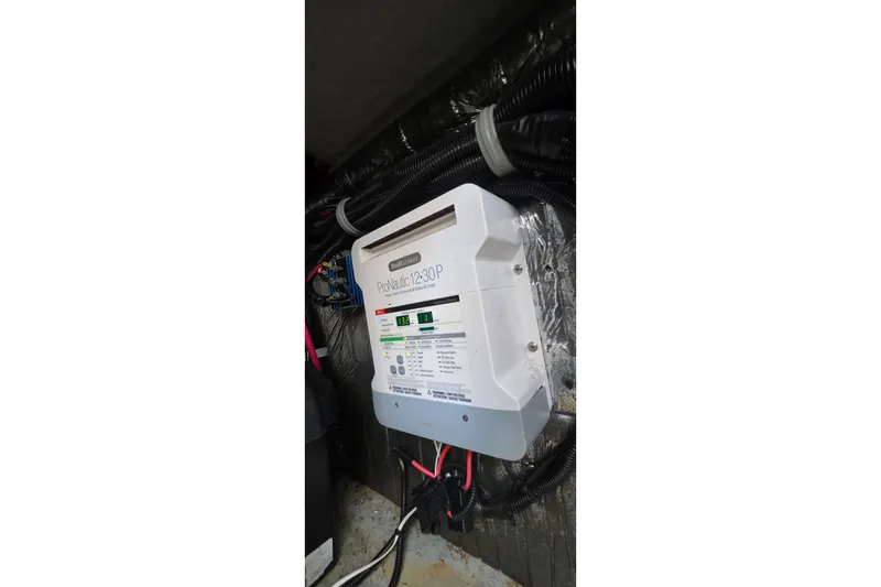 Slide: The Image of ProNautic 12-30P battery charger installed in a 2001 Doral 250se boat. - 33