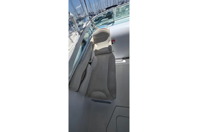 Slide: The Image of Interior view of a 2001 Doral 250se boat, featuring comfortable seating and sleek design. - 8