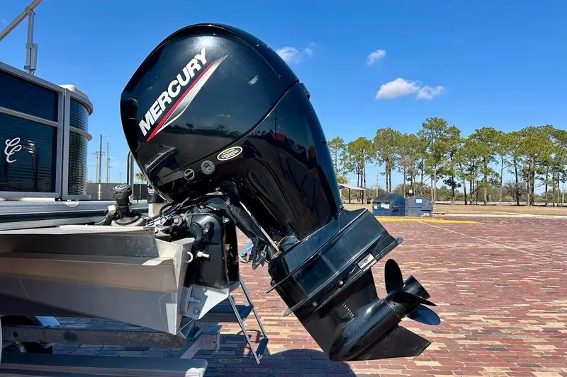Slide: The Image of 2023 Cypress Cay Seabreeze 232 with Mercury outboard motor on a sunny day. - 10