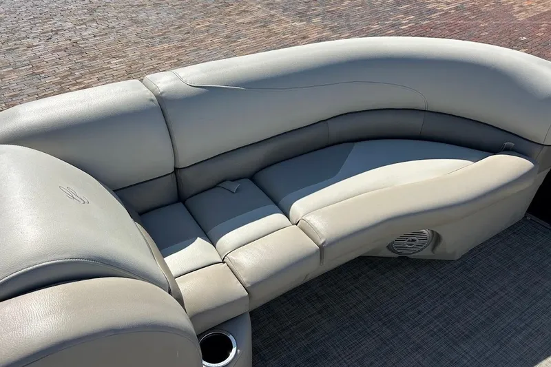 Slide: The Image of Luxurious seating on 2023 Cypress Cay Seabreeze 232 pontoon boat, featuring plush gray upholstery. - 19