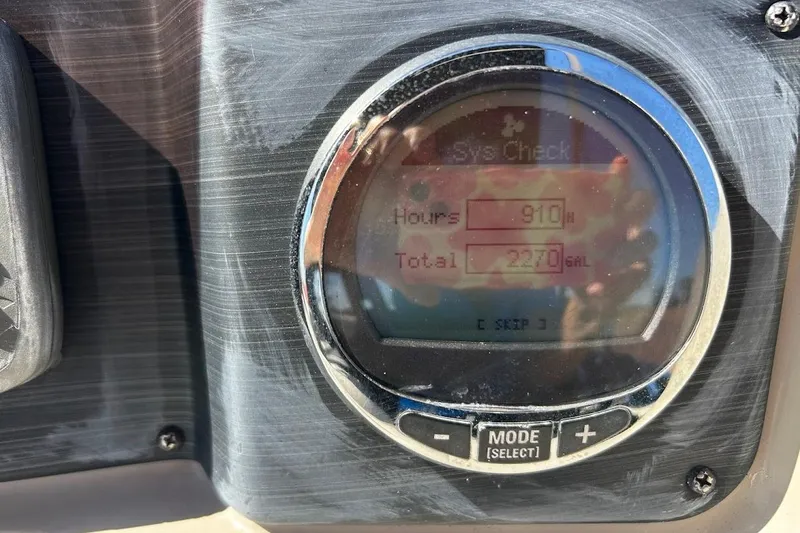Slide: The Image of Dashboard display of a 2023 Cypress Cay Seabreeze 232 showing 910 hours and 2270 gallons. - 24