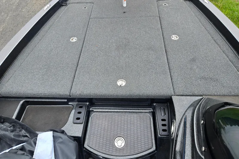 Slide: The Image of 2022 Caymas CX 19 boat deck with storage compartments and sleek design. - 15