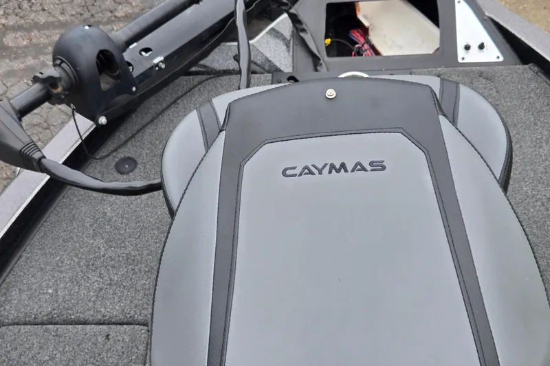 Slide: The Image of 2022 Caymas CX 19 boat interior with branded seat and steering components. - 17