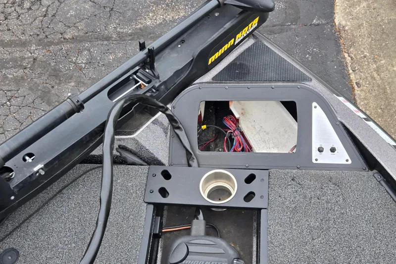 Slide: The Image of 2022 Caymas CX 19 boat deck with Minn Kota trolling motor and wiring compartment. - 18