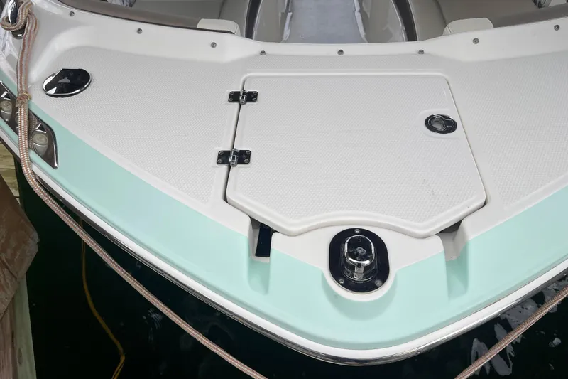 Slide: The Image of 2019 Chaparral 250 Suncoast boat bow with storage hatch and cleat. - 10