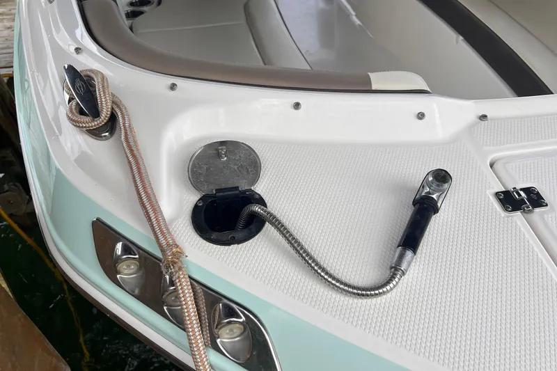 Slide: The Image of 2019 Chaparral 250 Suncoast boat deck with rope and metal fittings. - 14
