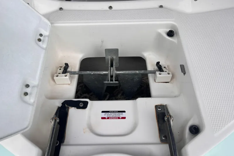 Slide: The Image of Anchor compartment of 2019 Chaparral 250 Suncoast boat, featuring secure storage. - 38