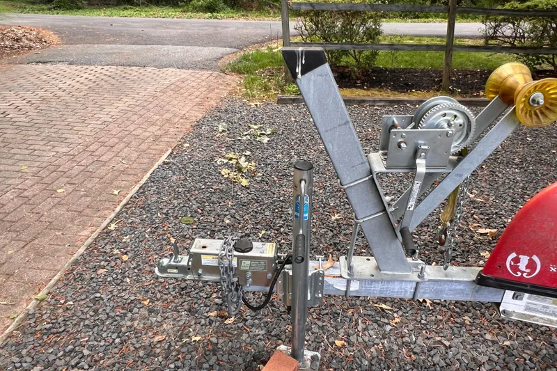 Slide: The Image of Trailer hitch and winch system for 2019 Chaparral 250 Suncoast boat on gravel driveway. - 45