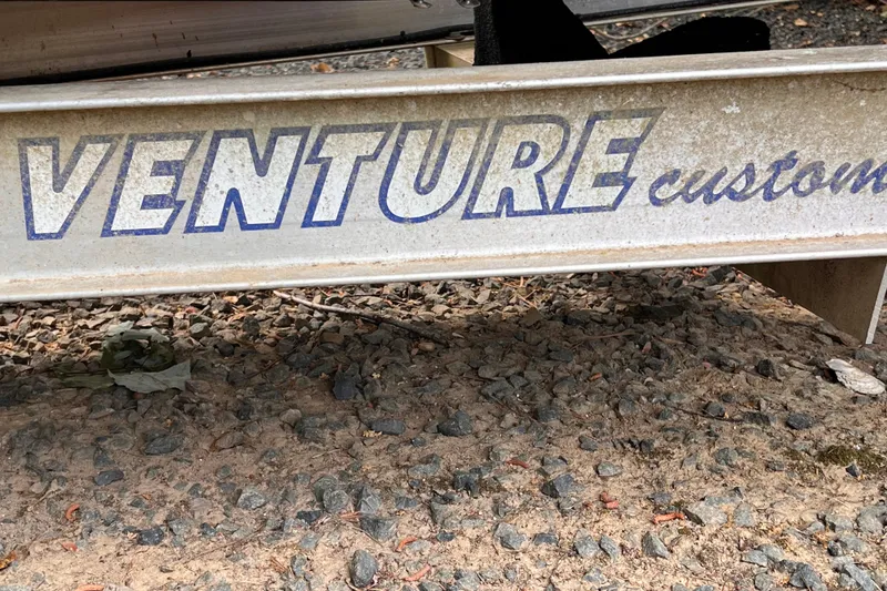Slide: The Image of Venture custom trailer for 2019 Chaparral 250 Suncoast on gravel surface. - 47