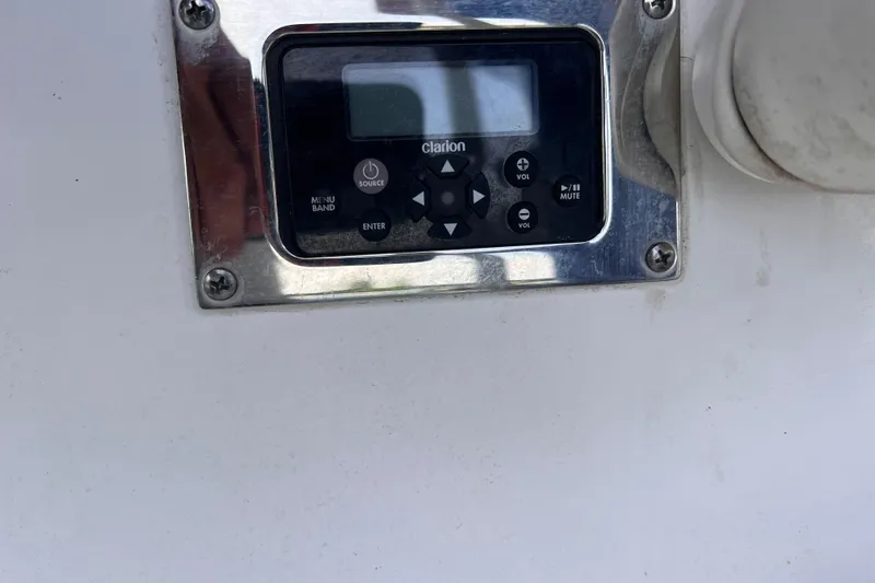 Slide: The Image of Control panel on a 2019 Chaparral 250 Suncoast boat, featuring Clarion audio system. - 50