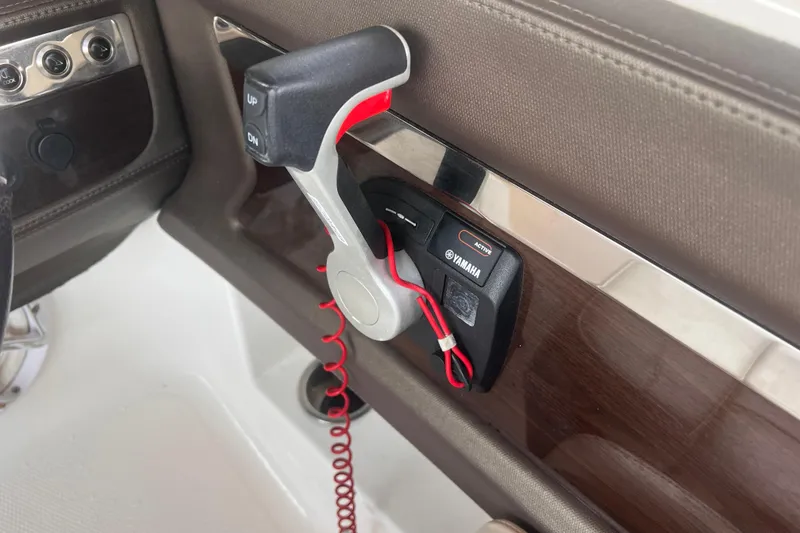 Slide: The Image of Control panel of a 2019 Chaparral 250 Suncoast boat with Yamaha throttle. - 56