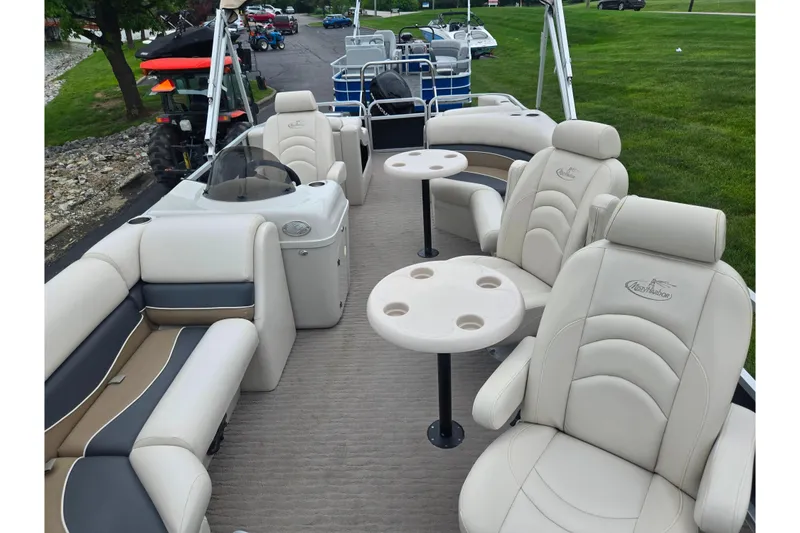 Slide: The Image of 2012 Misty Harbor 2285 Biscayne Bay RL pontoon boat with plush seating and tables. - 11