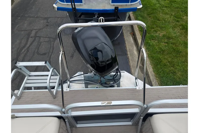 Slide: The Image of 2012 Misty Harbor 2285 Biscayne Bay RL pontoon boat with motor and ladder. - 17
