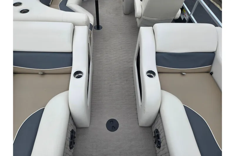 Slide: The Image of 2012 Misty Harbor 2285 Biscayne Bay RL boat interior with beige and gray seating. - 19