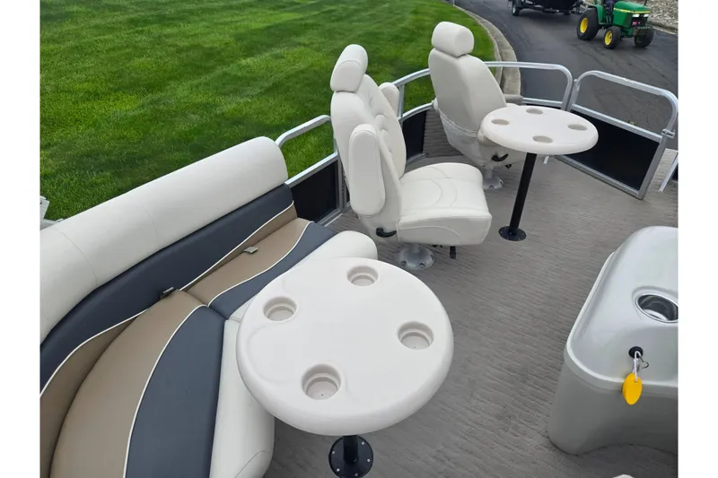 Slide: The Image of 2012 Misty Harbor 2285 Biscayne Bay RL pontoon boat interior with seating and tables. - 20