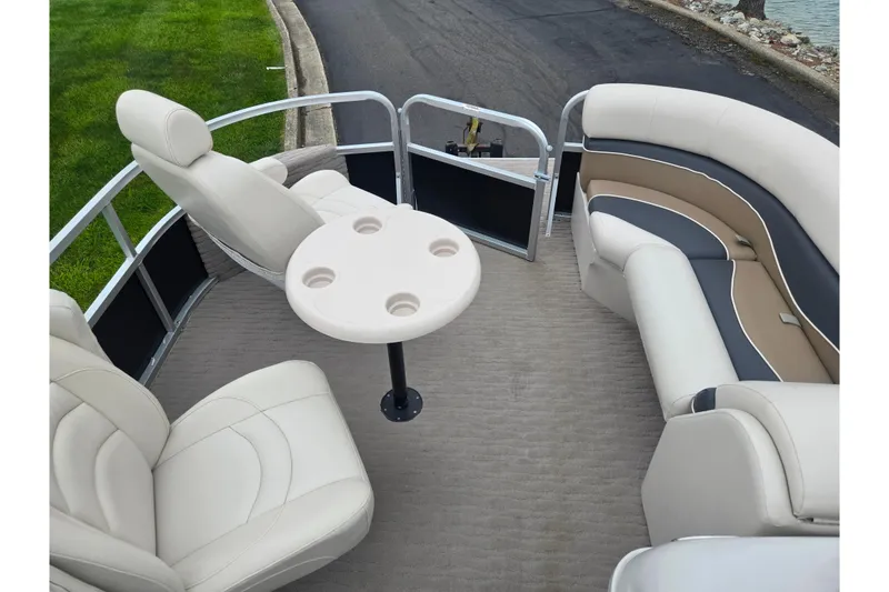 Slide: The Image of 2012 Misty Harbor 2285 Biscayne Bay RL pontoon boat interior with plush seating and table. - 22