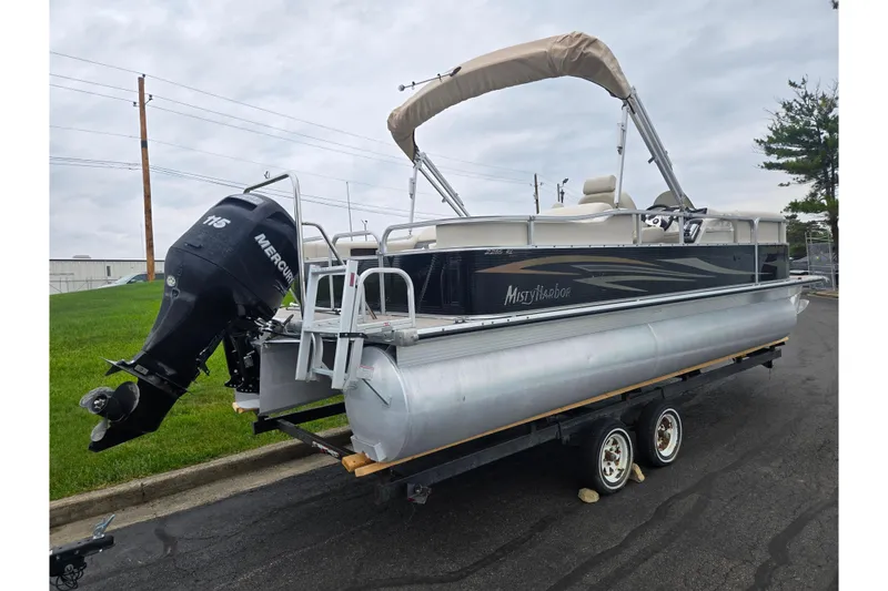 Slide: The Image of 2012 Misty Harbor 2285 Biscayne Bay RL pontoon boat on trailer with Mercury 115 outboard motor. - 3