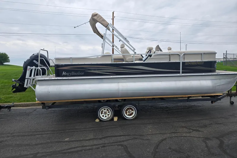 Slide: The Image of 2012 Misty Harbor 2285 Biscayne Bay RL pontoon boat on trailer, side view. - 4