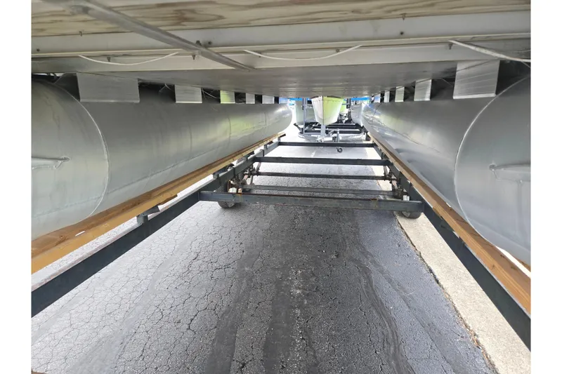 Slide: The Image of Underneath view of a 2012 Misty Harbor 2285 Biscayne Bay RL pontoon boat on a trailer. - 7