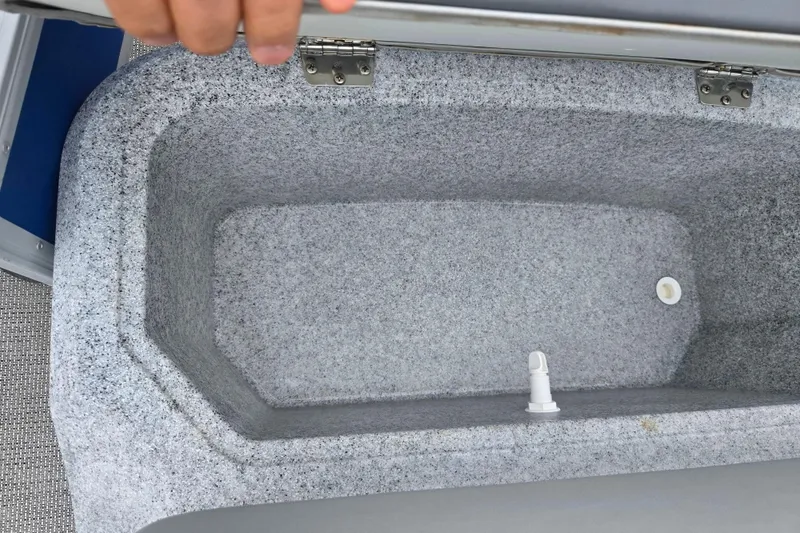 Slide: The Image of Open storage compartment in a 2021 Lexington 315 boat, featuring a gray interior. - 12