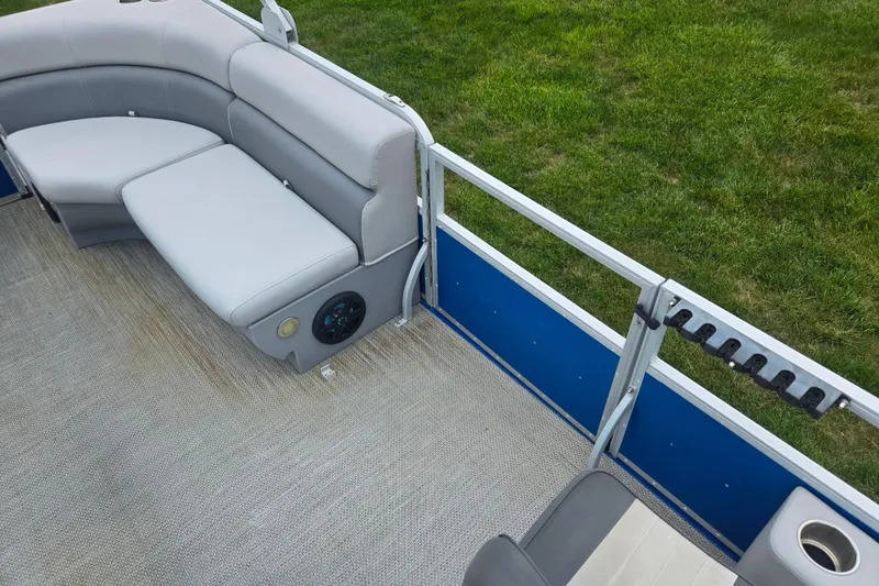 Slide: The Image of Luxurious Lexington 315 pontoon boat interior with plush seating, cup holder, and speaker, 2021 model. - 14